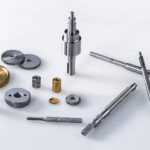 silver screw driver and round gold coins